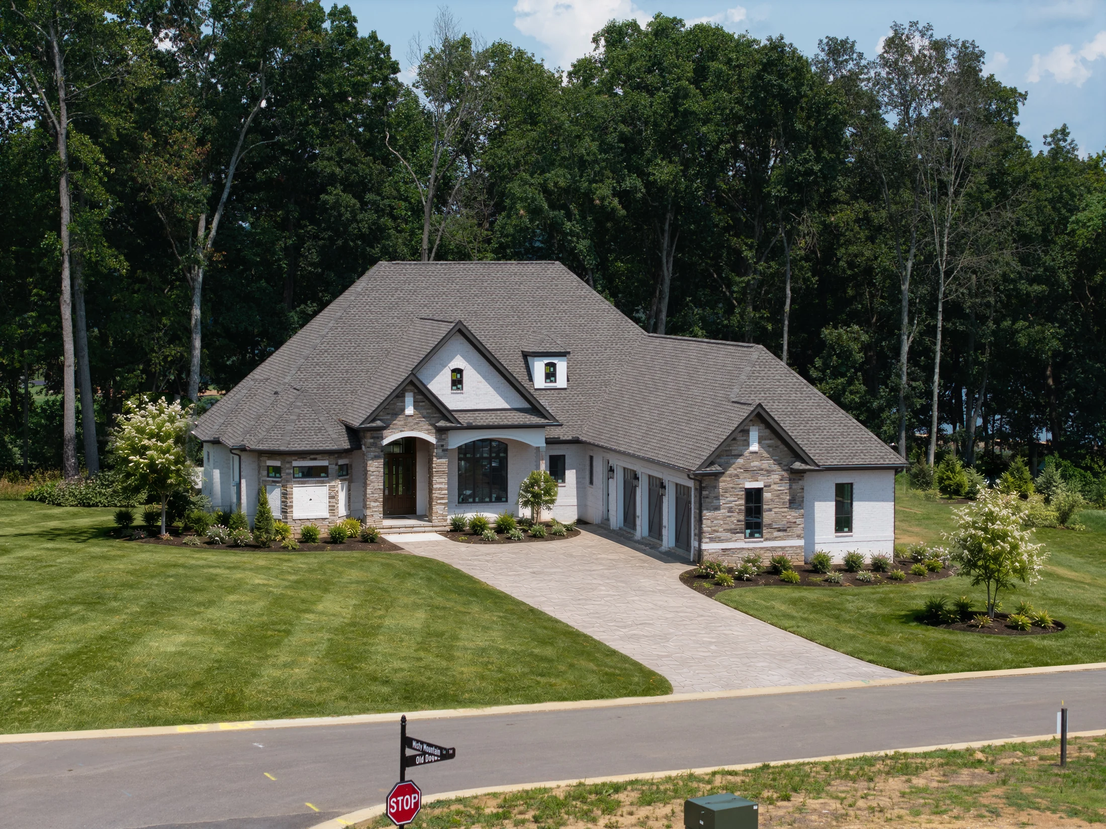 Glenturret home aerial showing the front elevation and wooded setting