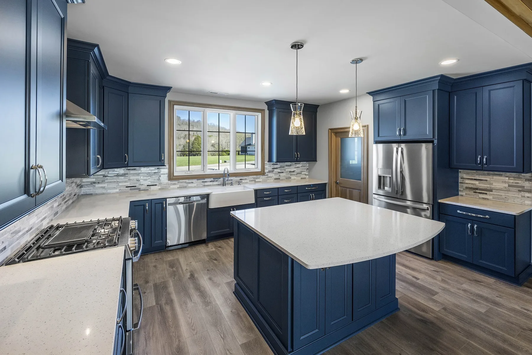 Kitchen with blue cabinetry and wood ceiling Kitchen with blue cabinetry and wood ceiling