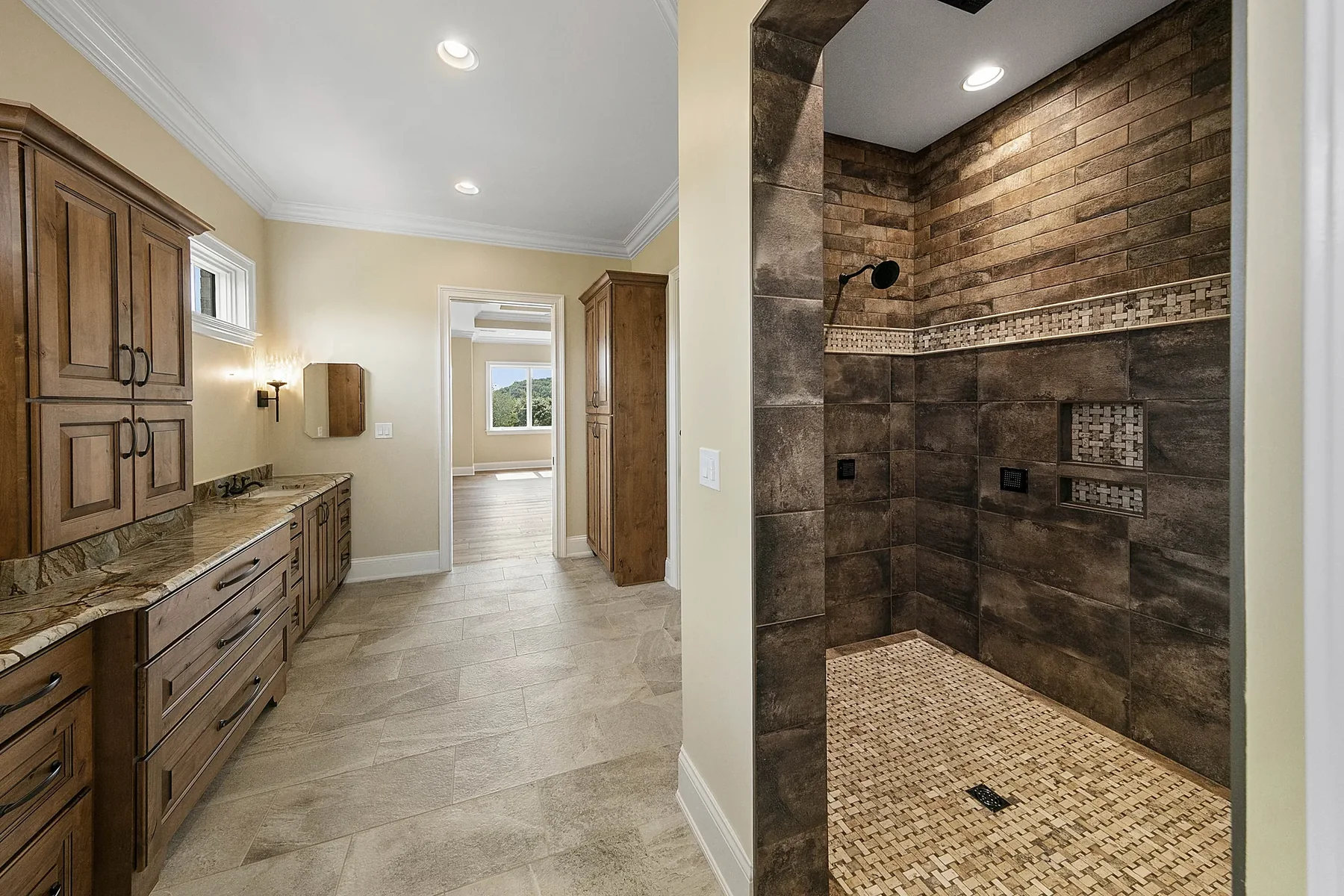 Bathroom with wood vanity and stone shower Bathroom with wood vanity and stone shower