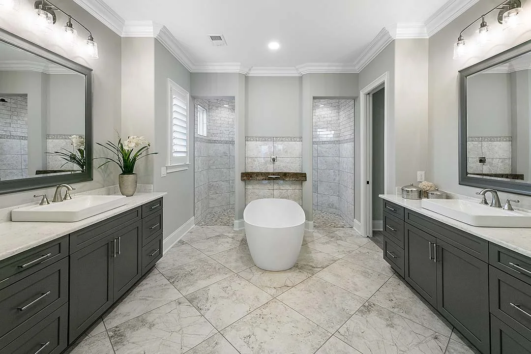 Bathroom with freestanding tub and twin vanities Bathroom with freestanding tub and twin vanities