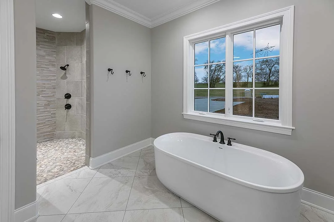Bathroom with freestanding tub and lake view Bathroom with freestanding tub and lake view