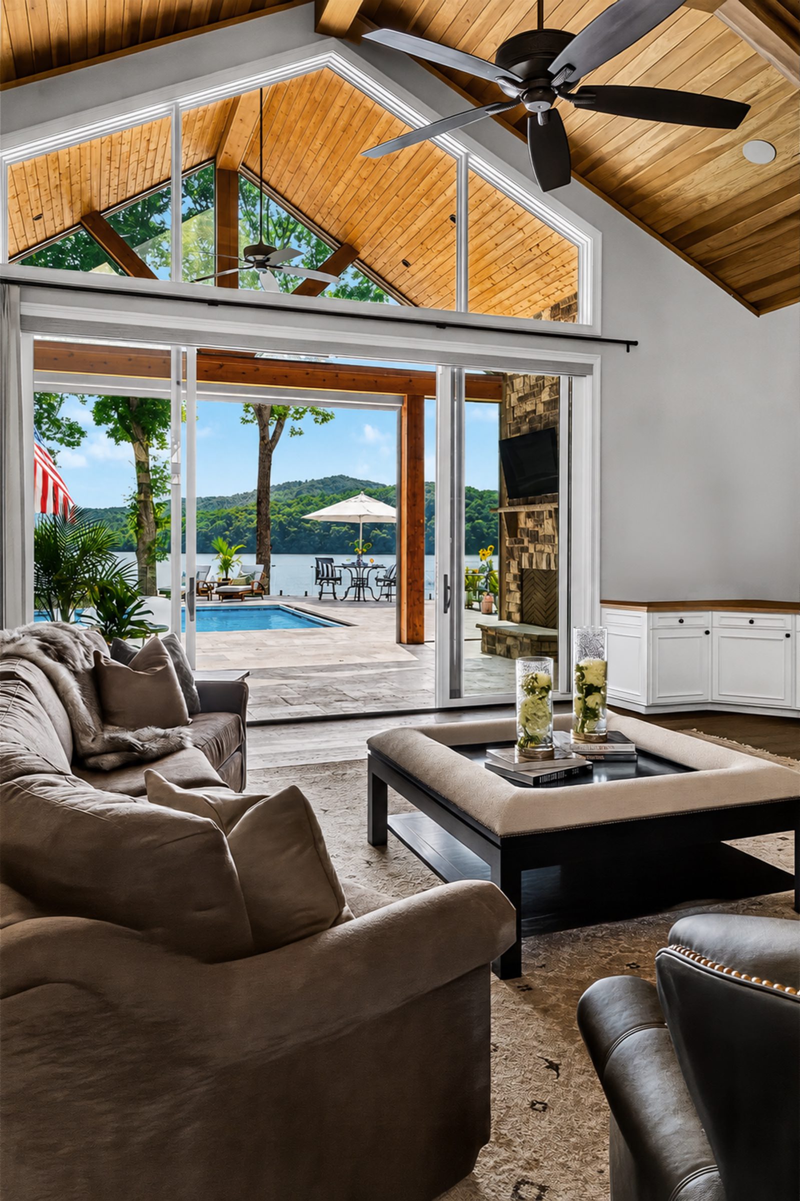 Finished lakefront great room opening to a pool and water view